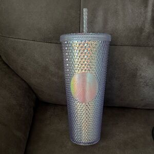 Starbucks Tumbler with a straw.